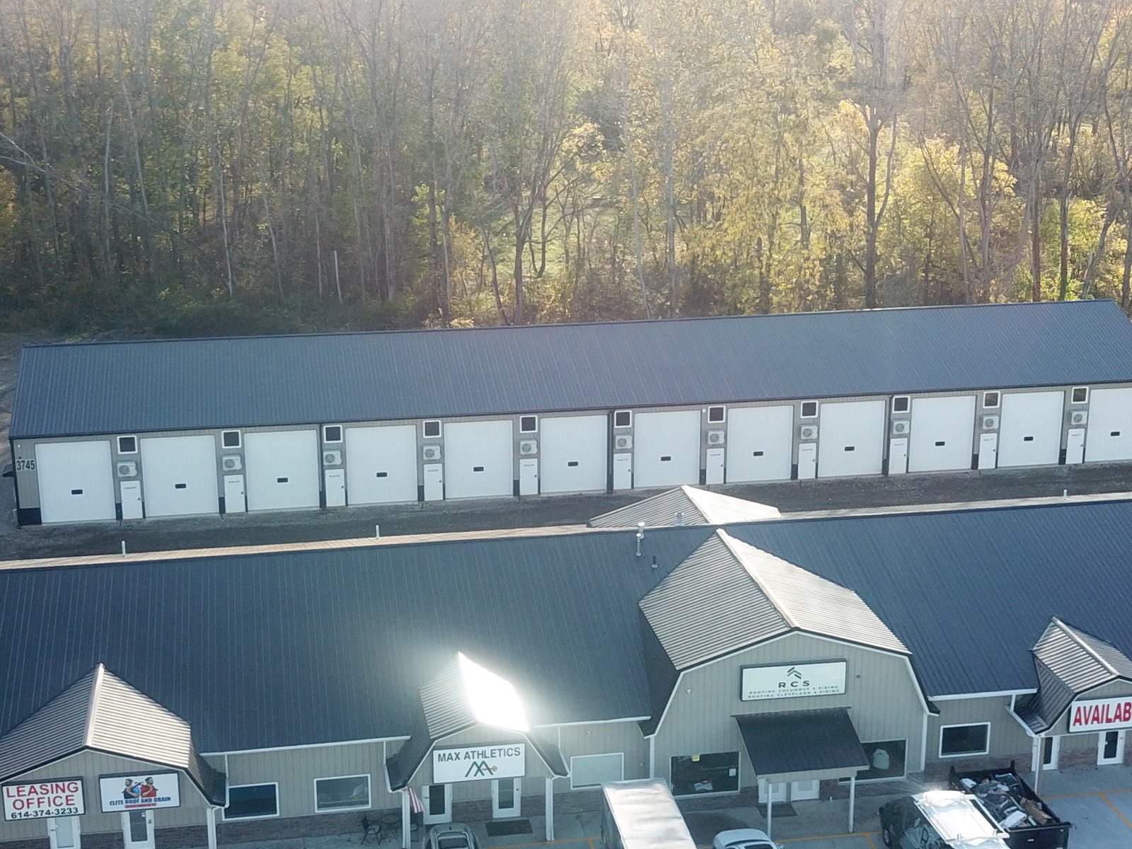 Front view of Buckeye Flex Space commercial suites with parking and store fronts